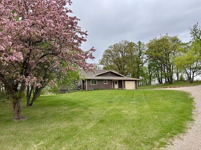 12787 Lumberjack Rd NW, Shevlin, MN 56676 - ranch-style home with a garage, a front yard, and driveway