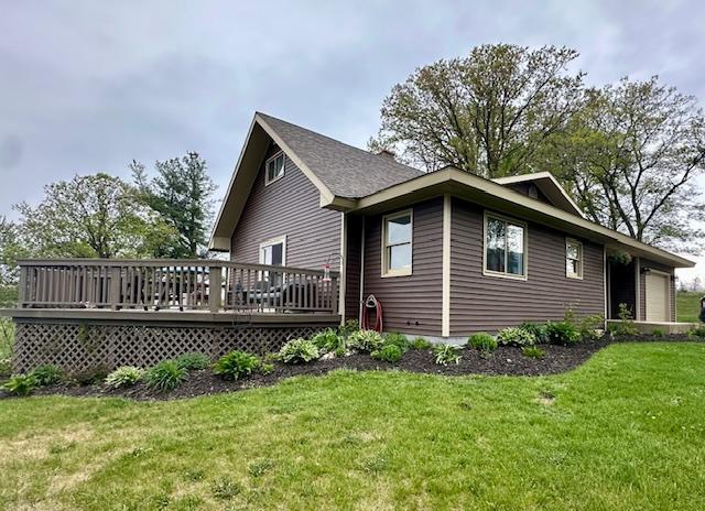 12787 Lumberjack Rd NW, Shevlin, MN 56676 - view of property exterior with a deck and a yard