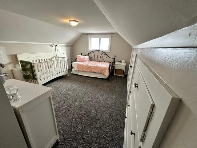 12787 Lumberjack Rd NW, Shevlin, MN 56676 - carpeted bedroom featuring lofted ceiling