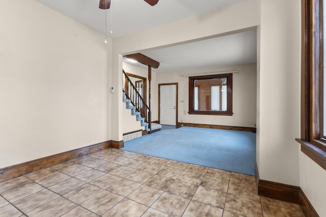 3301 Yosemite Ave S, Saint Louis Park, MN 55416 - empty room with light colored carpet, ceiling fan, baseboards, and stairway