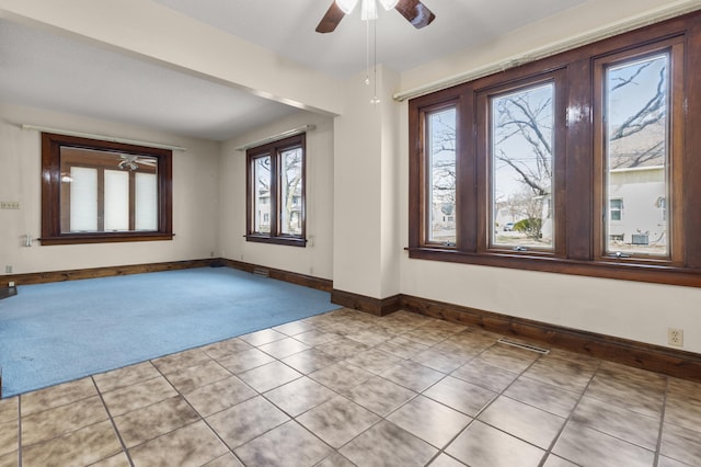 3301 Yosemite Ave S, Saint Louis Park, MN 55416 - unfurnished room featuring carpet floors, baseboards, a ceiling fan, and tile patterned flooring