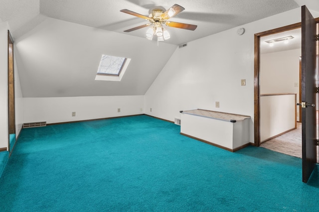 3301 Yosemite Ave S, Saint Louis Park, MN 55416 - bonus room featuring a skylight, lofted ceiling, carpet, ceiling fan, and a textured ceiling