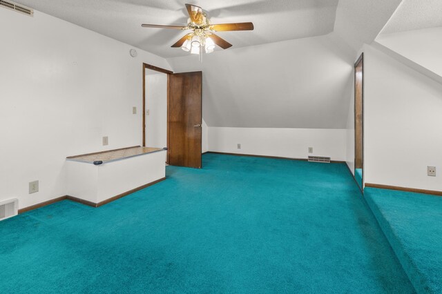 3301 Yosemite Ave S, Saint Louis Park, MN 55416 - additional living space featuring lofted ceiling, a ceiling fan, carpet flooring, a textured ceiling, and baseboards