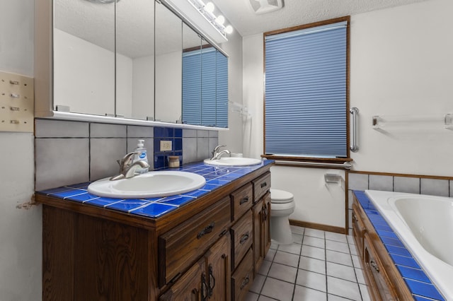 3301 Yosemite Ave S, Saint Louis Park, MN 55416 - full bathroom with tile patterned flooring, tasteful backsplash, a bath, double vanity, and a textured ceiling