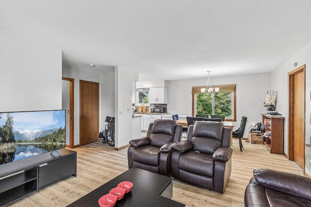 184 Baker St E, Saint Paul, MN 55107 - living room with light wood-type flooring and a textured ceiling