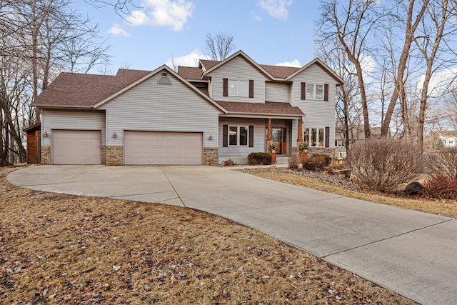 567 Forest Ln, Medford, MN 55049 - view of front facade with concrete driveway, an attached garage, a porch, and a shingled roof