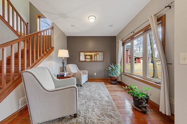 567 Forest Ln, Medford, MN 55049 - sitting room featuring hardwood / wood-style floors, stairs, baseboards, and visible vents