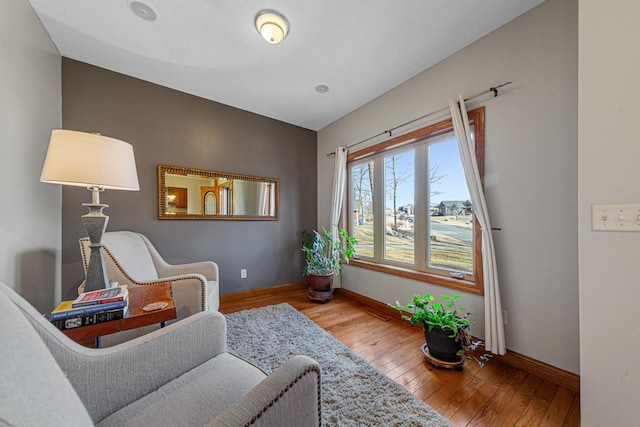 567 Forest Ln, Medford, MN 55049 - living area featuring hardwood / wood-style flooring and baseboards