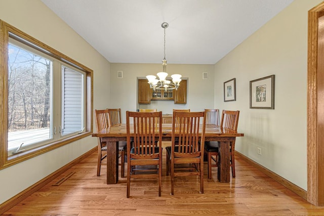 567 Forest Ln, Medford, MN 55049 - dining room with a wealth of natural light, an inviting chandelier, and light wood-type flooring