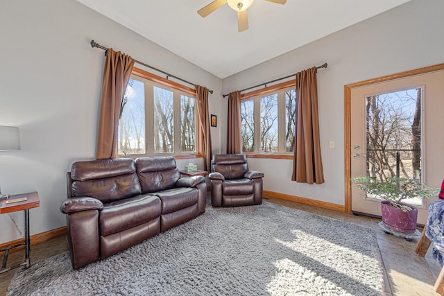 567 Forest Ln, Medford, MN 55049 - living area with baseboards, a ceiling fan, and vaulted ceiling