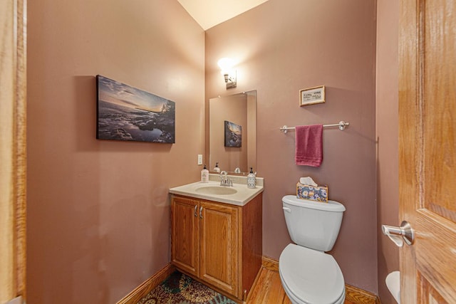 567 Forest Ln, Medford, MN 55049 - bathroom featuring baseboards, vanity, and toilet