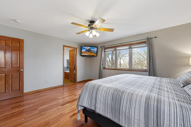 567 Forest Ln, Medford, MN 55049 - bedroom with ensuite bath, ceiling fan, baseboards, and light wood-type flooring