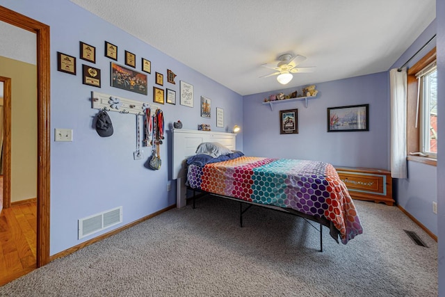 567 Forest Ln, Medford, MN 55049 - carpeted bedroom with baseboards, visible vents, and ceiling fan