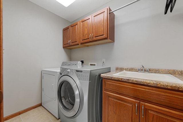 567 Forest Ln, Medford, MN 55049 - clothes washing area with a sink, washer and clothes dryer, baseboards, cabinet space, and light tile patterned floors