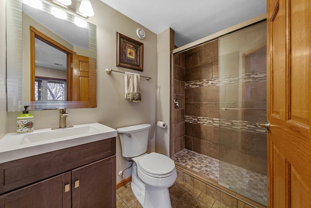 567 Forest Ln, Medford, MN 55049 - bathroom featuring a shower stall, toilet, vanity, and baseboards