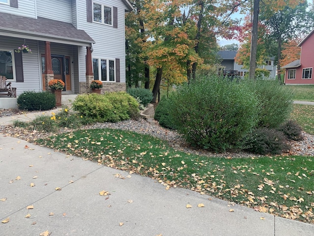 567 Forest Ln, Medford, MN 55049 - view of side of home with brick siding and a porch