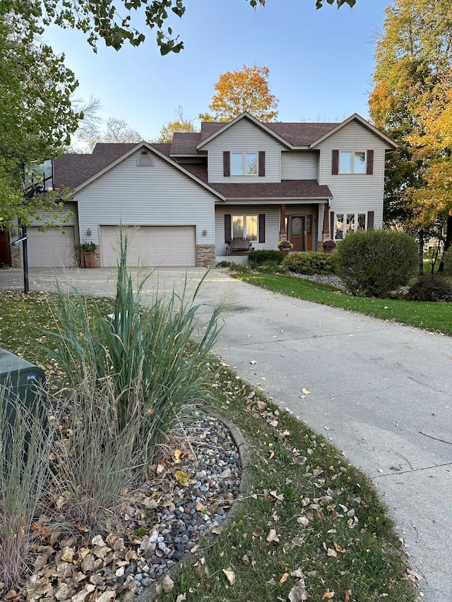 567 Forest Ln, Medford, MN 55049 - traditional home with a garage, a shingled roof, and concrete driveway