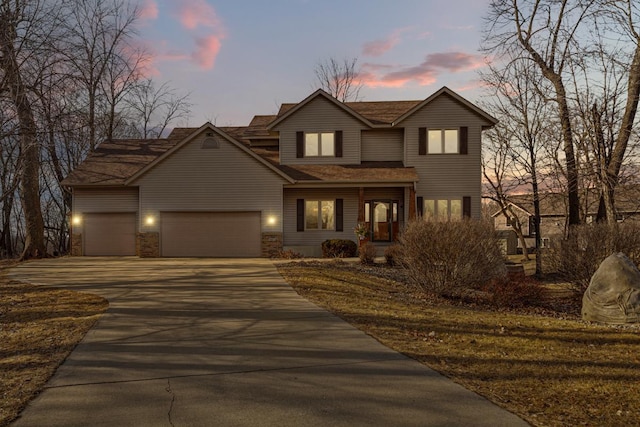 567 Forest Ln, Medford, MN 55049 - traditional home featuring an attached garage and concrete driveway