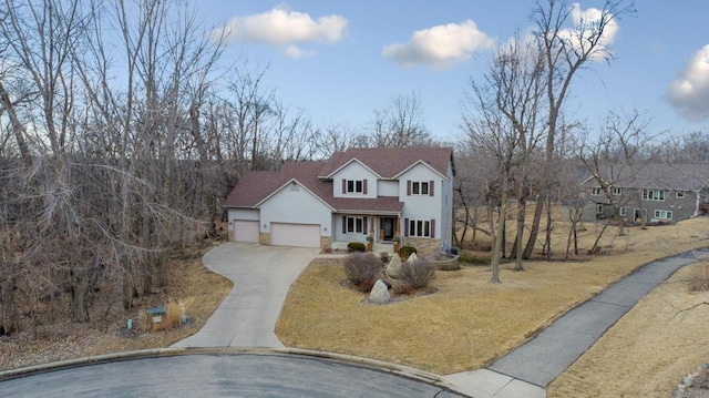 567 Forest Ln, Medford, MN 55049 - traditional-style house with driveway, stone siding, a garage, a shingled roof, and a front yard
