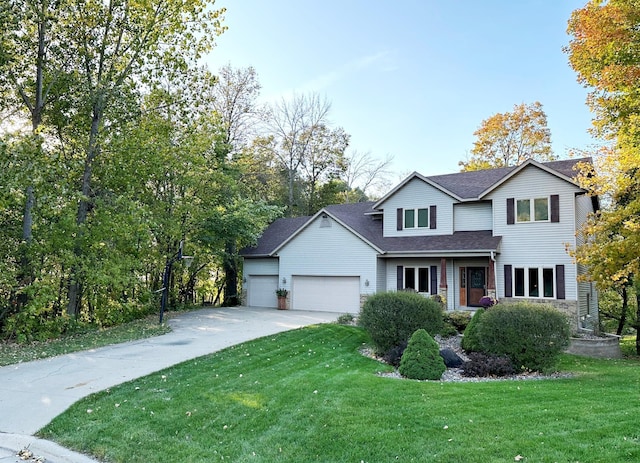 567 Forest Ln, Medford, MN 55049 - traditional-style home with a garage, driveway, a shingled roof, and a front lawn