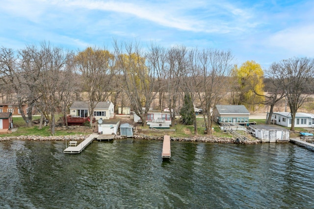 dock area featuring a residential view and a water view