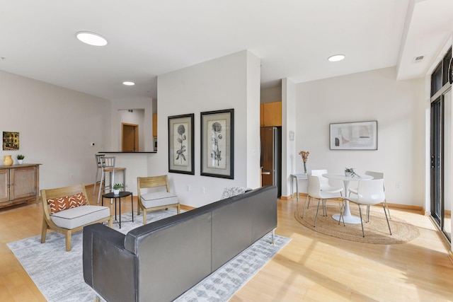 3707 Grand Way Unit 101, Saint Louis Park, MN 55416 - living room featuring light wood-type flooring, recessed lighting, and baseboards