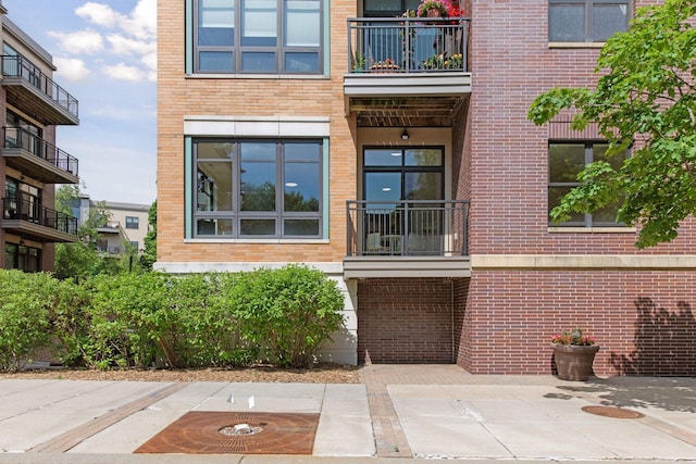 3707 Grand Way Unit 101, Saint Louis Park, MN 55416 - doorway to property featuring brick siding and a balcony