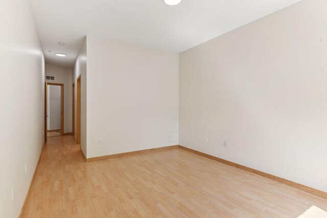 3707 Grand Way Unit 101, Saint Louis Park, MN 55416 - empty room with light wood-style flooring, baseboards, and recessed lighting