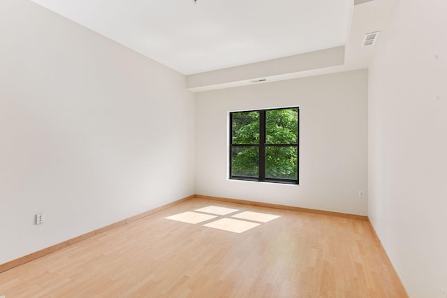 3707 Grand Way Unit 101, Saint Louis Park, MN 55416 - spare room featuring wood finished floors and baseboards