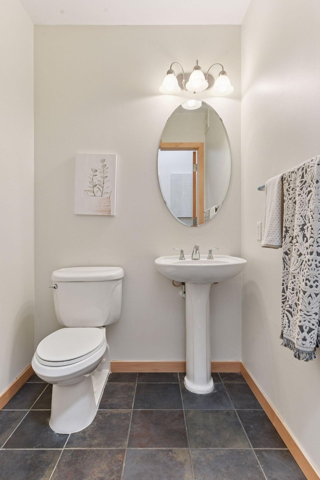 3707 Grand Way Unit 101, Saint Louis Park, MN 55416 - bathroom featuring baseboards and toilet