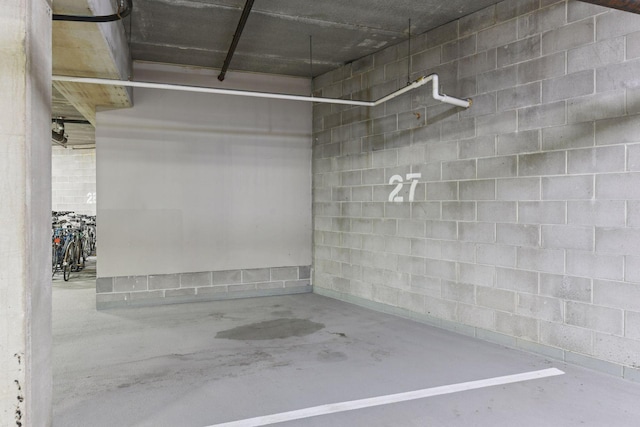 3707 Grand Way Unit 101, Saint Louis Park, MN 55416 - parking deck featuring concrete block wall