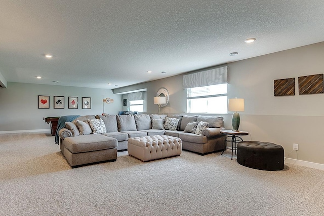carpeted living room featuring recessed lighting, a textured ceiling, and baseboards