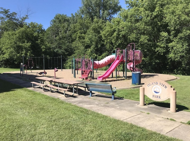 community play area with a lawn