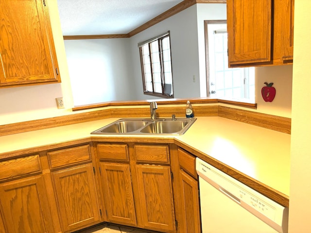 kitchen with light countertops, ornamental molding, a sink, white dishwasher, and brown cabinetry