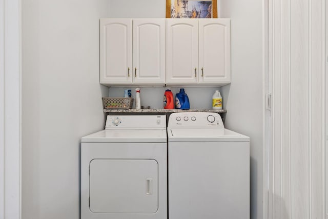 laundry area featuring cabinet space and independent washer and dryer