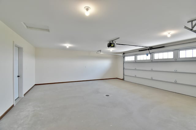 garage featuring baseboards and a garage door opener