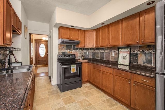 kitchen featuring under cabinet range hood, brown cabinets, a sink, and electric range oven