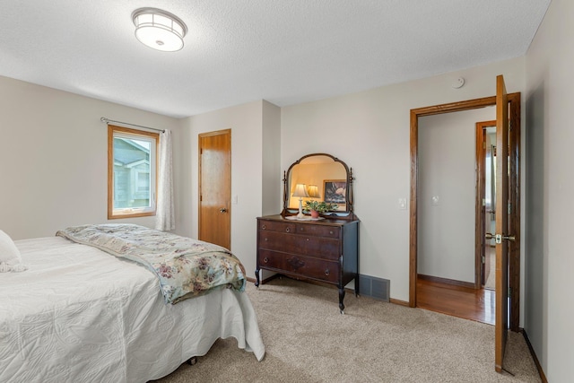 7165 Upper 157th St W, Apple Valley, MN 55124 - carpeted bedroom with a textured ceiling and baseboards