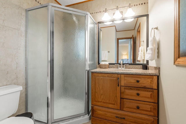 7165 Upper 157th St W, Apple Valley, MN 55124 - bathroom with a shower stall, toilet, vanity, and tile walls