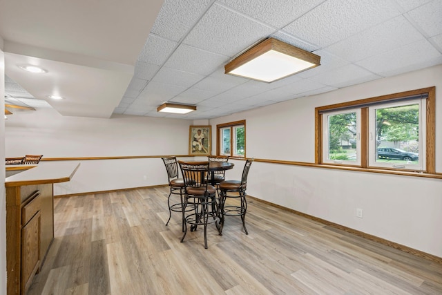 7165 Upper 157th St W, Apple Valley, MN 55124 - dining space with plenty of natural light, light wood-type flooring, baseboards, and a paneled ceiling