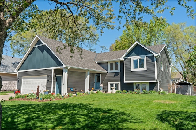 7165 Upper 157th St W, Apple Valley, MN 55124 - tri-level home with a front yard, a shingled roof, a garage, and concrete driveway