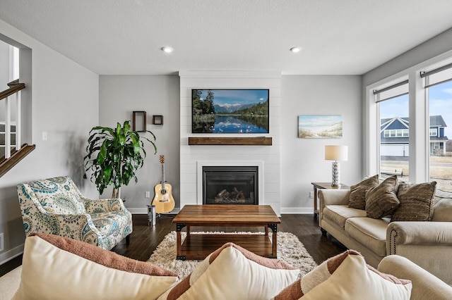 2301 Kester Ave NE, Saint Michael, MN 55376 - living area featuring recessed lighting, baseboards, wood finished floors, and a fireplace