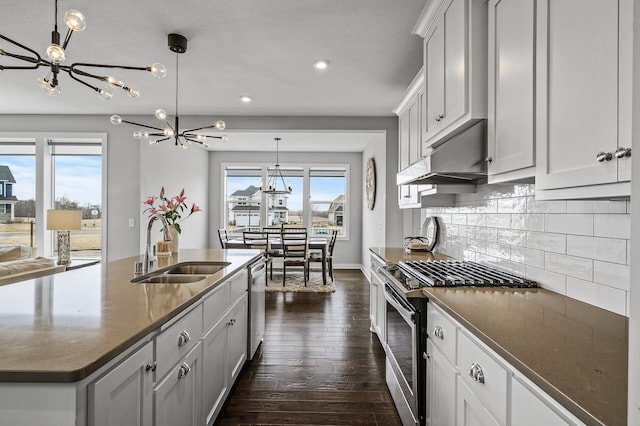 2301 Kester Ave NE, Saint Michael, MN 55376 - kitchen with an inviting chandelier, a sink, dark wood-style flooring, and appliances with stainless steel finishes