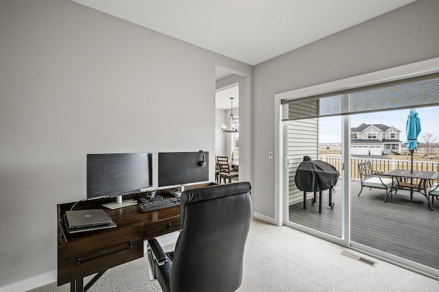 2301 Kester Ave NE, Saint Michael, MN 55376 - office featuring light colored carpet, baseboards, a notable chandelier, and visible vents