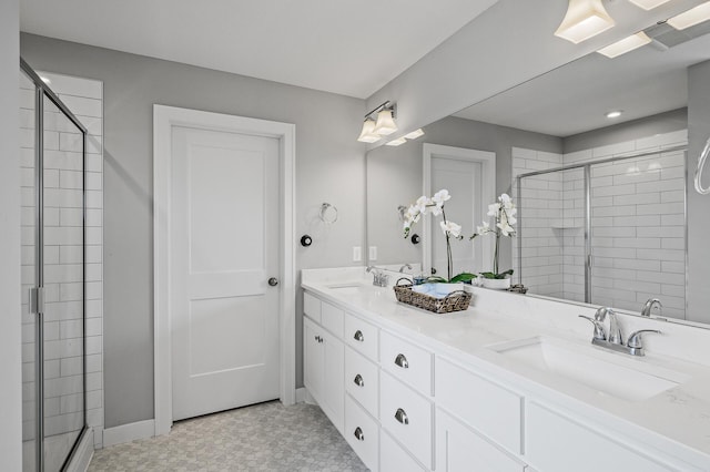 2301 Kester Ave NE, Saint Michael, MN 55376 - full bathroom with double vanity, baseboards, a shower stall, and a sink