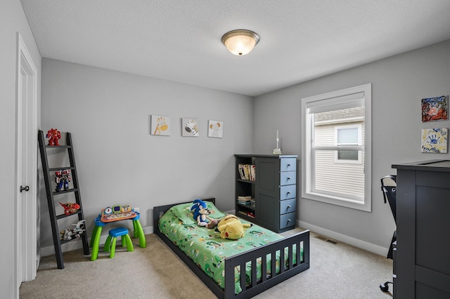 2301 Kester Ave NE, Saint Michael, MN 55376 - bedroom featuring baseboards, carpet, a textured ceiling, and visible vents