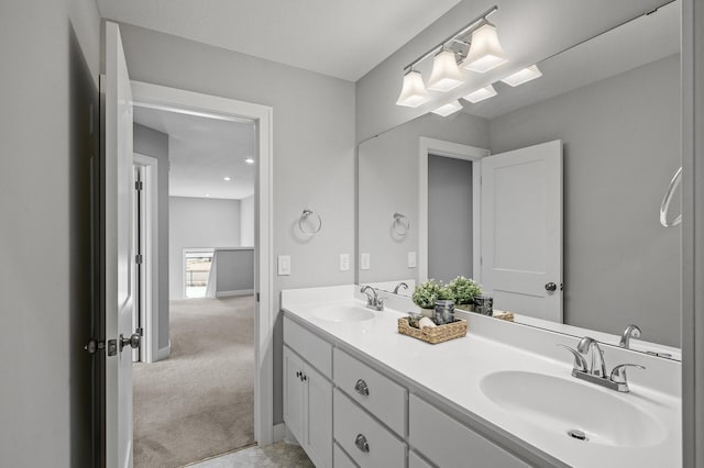 2301 Kester Ave NE, Saint Michael, MN 55376 - bathroom with a sink, baseboards, and double vanity