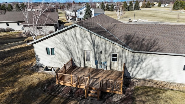 46377 Sunset Ct, Morris, MN 56267 - back of property with roof with shingles, a wooden deck, and a residential view