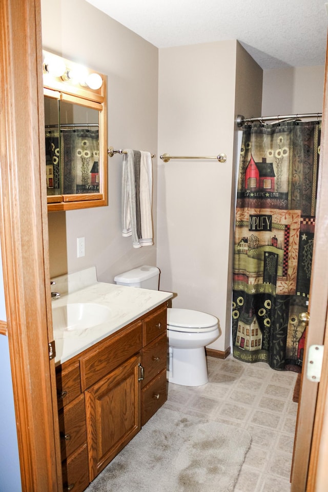 46377 Sunset Ct, Morris, MN 56267 - bathroom featuring toilet, vanity, and a shower with curtain