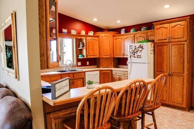 46377 Sunset Ct, Morris, MN 56267 - kitchen featuring white appliances, open shelves, a breakfast bar, light countertops, and a sink